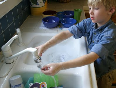 NAMC montessori practical life activities home classroom boy washing hands