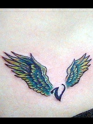 cross tattoos on back with wings. images Cross Tattoos For Men