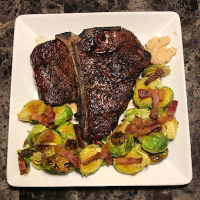 Rare grilled porterhouse with bacon roasted Brussels sprouts