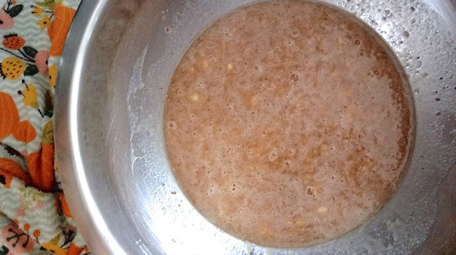 the wet ingredients for Caramelized Banana Bread mixed up in a stainless steel bowl