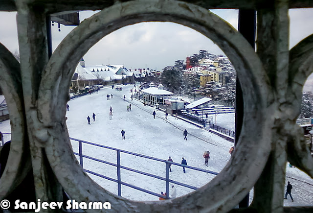 Shimla is enjoying the fresh snowfall on the hills and people have come out to celebrate in white Shimla. Let's check out these mobile clicks from Shimla by Mr Sanjeev Sharma (Senior Reporter, Zee).Here is a photograph of Shimla covered with snow layer and all white. Photograph has been clicked from one end of the mall road near Oberoi Hotel. Ridge Church looks amazing on top of the town and everything else covered with White layer of fresh snowfall.Shimla meteorological office director Manmohan Singh said, high hills of state would get heavy snowfall on Friday and moderate snowfall on Saturday. So many folks in Chandigarh & Delhi are supposed to come to Himachal to experience fresh snowfall during the weekend.A brilliantly clicked photograph of Sanjeev Sharma, which shows the view of Ridge ground in Shimla. There is a small place to overlook this whole ground and photograph is clicked from the same place. This elevated shed comes of the way from Ridge Ground to Jakhu Temple. A photograph of Shimla Club which is again situated on Mall Road. This is one of the great place to celebrate special occasions, although everyone is not allowed in Shimla Club.Hoteliers in Shimla & other places of Himachal Pradesh say snowfall would prove boon for tourism as visitors would throng Himachal to see the fresh snow. Many trourists visit Shimla during winters in a hope to see fresh snowfall happening. Traffic in these towns was partially affected in upper. There was minimal impact on main highways connecting Shimla & Manali to Chandigarh/Delhi.A view of Christ Church from mall road, just below it. This church is situated on the famous Ridge ground of Shimla.Ridge ground view after fresh snowfall in Shimla. Although there are some footsteps on the snow, which shows that many shimlites have already had a round on ridge ground to enjoy in first snowfall of 2013.Upper reaches of Himachal Pradesh received snowfall on Thursday much to the delight of tourists and residents, who had been experiencing sub-zero temperatures for the past one month. Since Thursday morning, Shimla and Manali received 5 to 8cm snow while Rohtang pass in Kullu district got over 60cm. It had last snowed in Shimla and Manali on December 14.