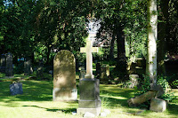 Gravestones in sunlight - Photo by Georg Arthur Pflueger on Unsplash