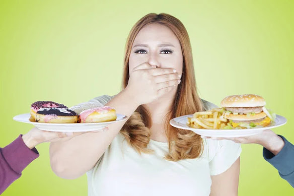 Girl refusing high calorie foods