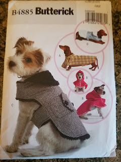 Picture of the pattern. Several dogs with coats are shown.