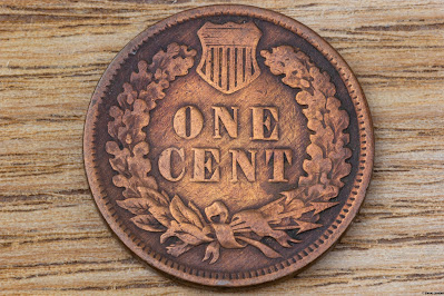 Back view of a 1901 Indian Head Penny, featuring a wreath and the words "One Cent."