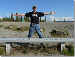 Jerry at the Yukon Alaska Border - a foot in each country.