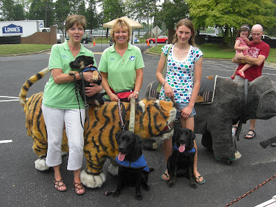 Picture of some of the puppies in our group, beside the fake lions & elephants 