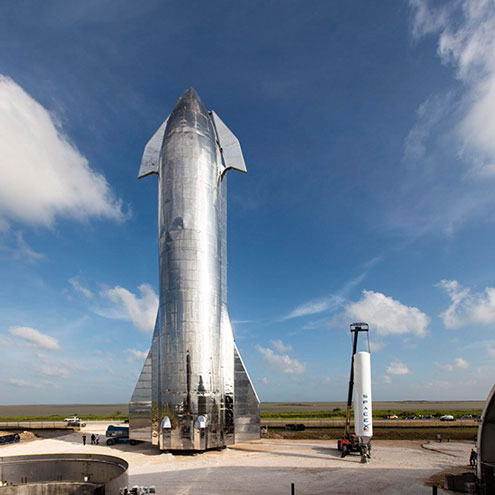 SpaceX Starship next to Falcon One Source( https://www.space.com/spacex-starship-reach-orbit-six-months.html)