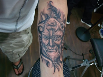 god portrait tattoo on the arm