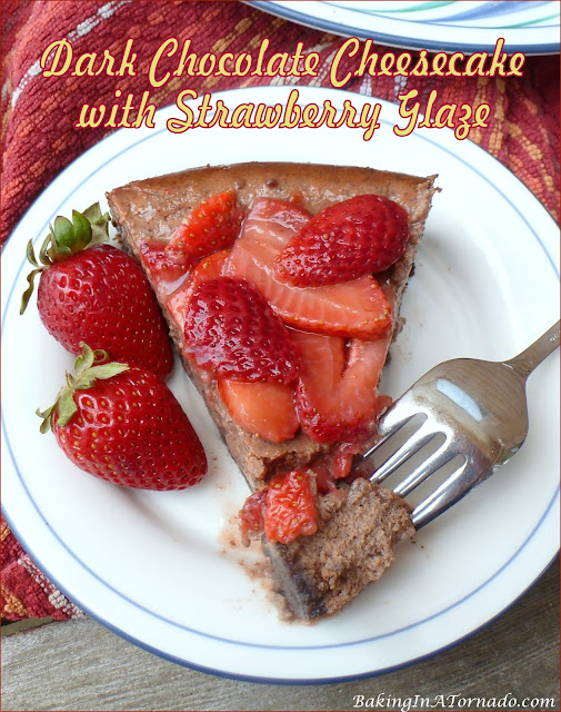 Dark Chocolate Cheesecake with Strawberry Glaze | recipe developed by www.BakingInATornado.com | #recipe #dessert