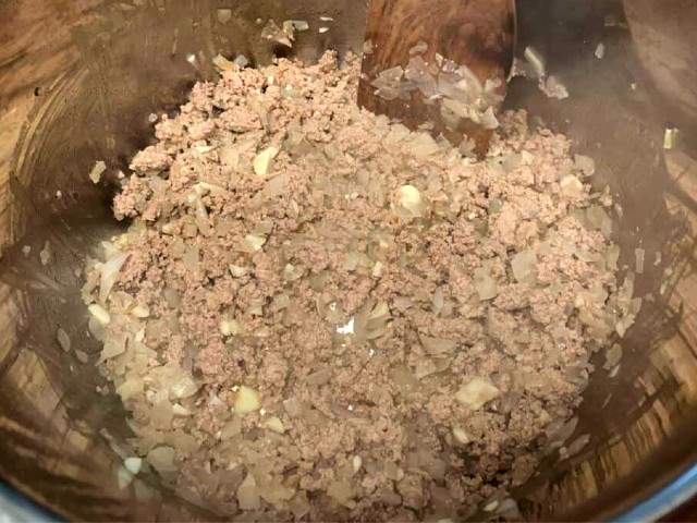 Sauté the onion and ground turkey in olive oil