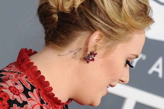 Adele shows off new ‘Paradise’ tattoo on her left hand