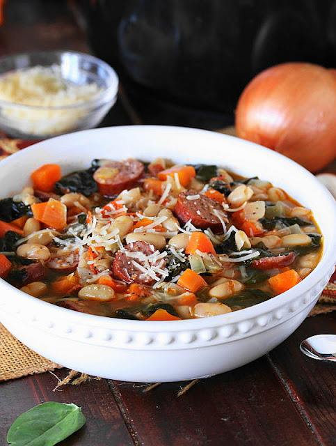 Bowl of White Bean & Kielbasa Soup with Spinach Image