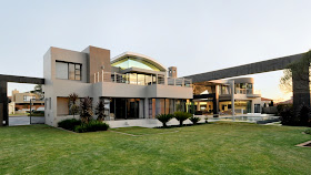 MOdern home and green grass in the backyard 