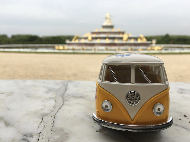 Yellow Van with fountain at the gardens of Versailles