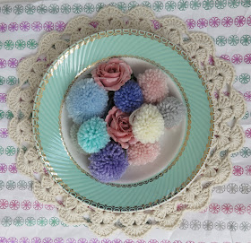 pompons, pastel, thrifted, plate, paper, crochet