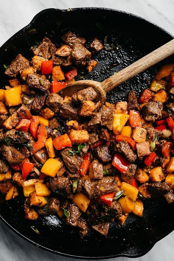 This recipe for Whole30 steak bites is packed with tons of flavor and huge pops of vitamins thanks to colorful sweet potatoes and bell peppers