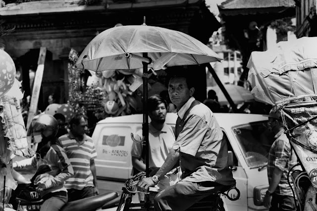 A rickshaw driver waiting for his next customer