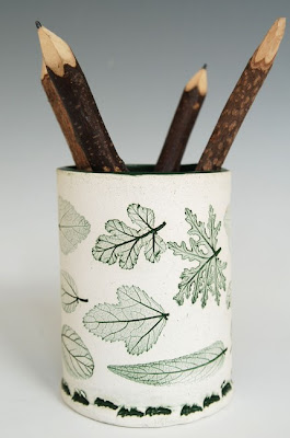 stoneware pencil cup, green leaves on white background