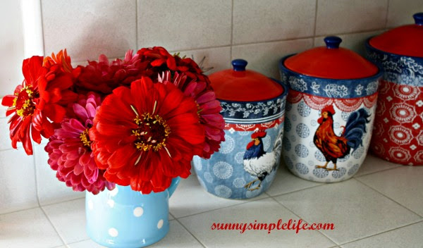 zinnias in vase, chicken canisters