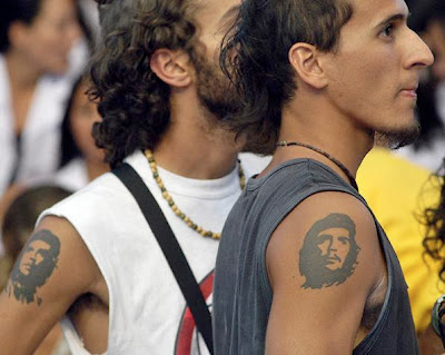 Two Cuba young male with Che Guevara tattoo on their upper arm.
