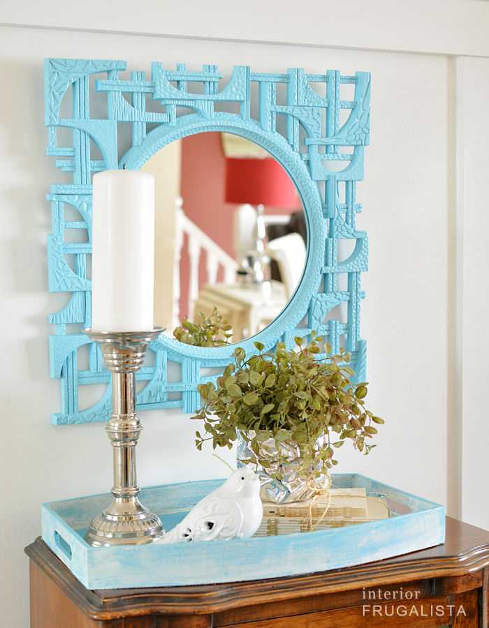 An upcycled Coppercraft guild mirror painted a bright Aqua turquoise color.