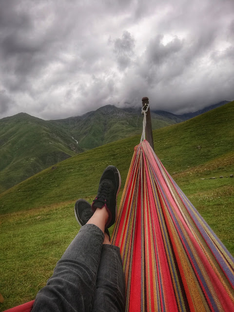 person laying in hammock, unsplash.com