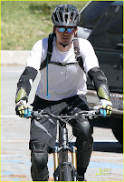 Orlando Bloom Bikes with a friend