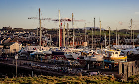 Photo looking across the hard-standing at Maryport Marina from the sea wall