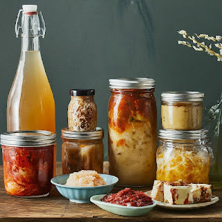 A colorful array of fermented foods, featuring vibrant kimchi and tangy sauerkraut, highlighting the diverse flavors and health benefits of these probiotic powerhouses in global cuisine.