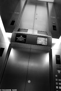 An elevator with a mirrored ceiling