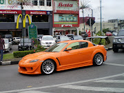 Orange Mazda RX8 with very nice body kit, spotted in Kuching Sarawak.