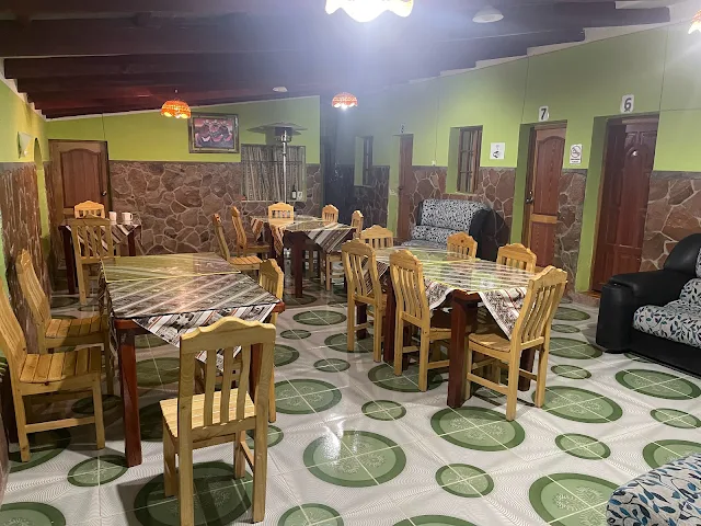 Dining area with the Hostel Rooms around, Latitudes Hostal, Huyajara, Laguna Colorada, Bolivia