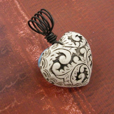 molded polymer clay pendant