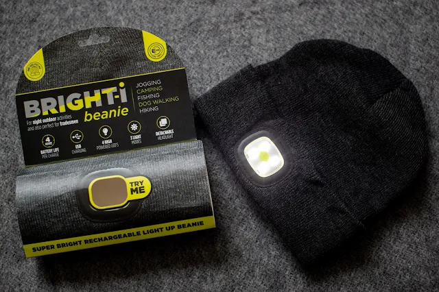 The beanie packaging and the hat with the light turned on and 4 LEDs visible