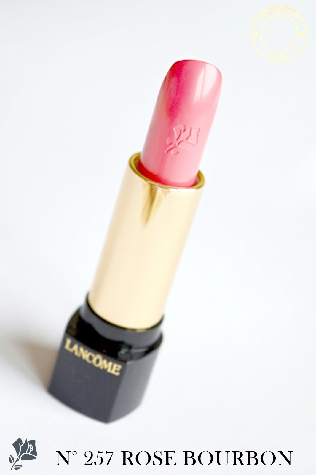 LANCÔME L'Absolu Rouge Rose Bourbon 257 - lettering and open lipstick