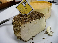 a two pound square wheel of herb coated Brindamour cheese.