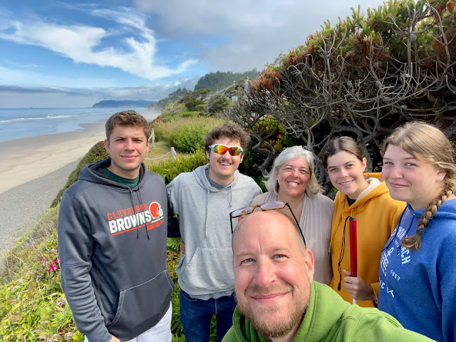 A family selfie taken by Dad in the backyard overlooking the ocean. Dad is in front and behind him (from left to right) are Josh, Andy, Me, You, Margie.