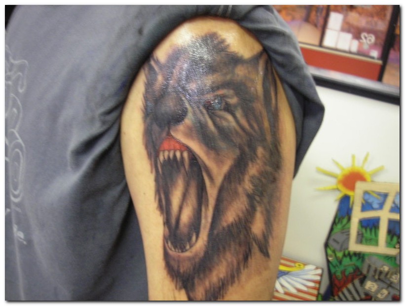 wolf tattoos. Howling Wolf Tattoo.