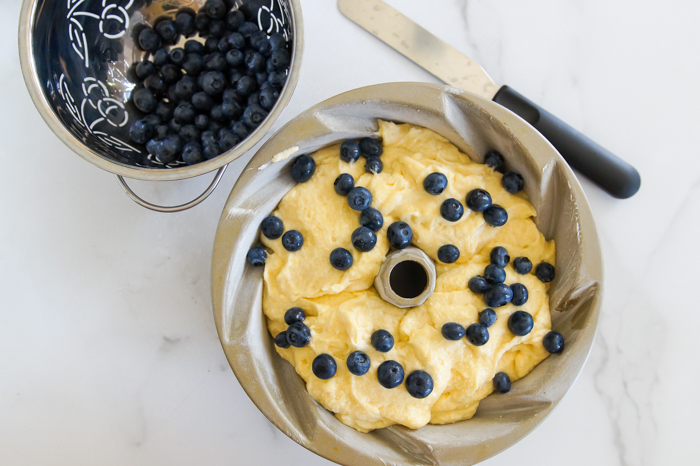    You know how we love to celebrate a    Frosted Lemon Blueberry Bundt Cake 