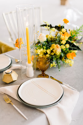 white and yellow reception table decor