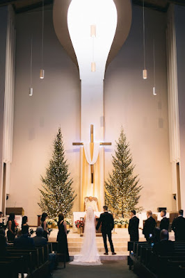 bride and groom standing at church altar