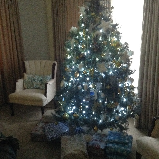 Living room decorated with Christmas tree in vintage style