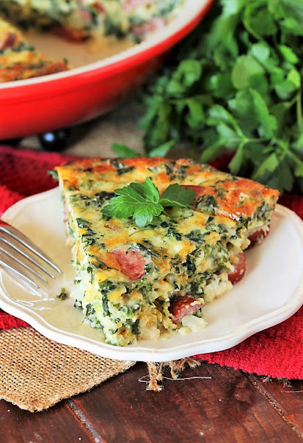 Slice of Crustless Smoked Sausage & Spinach Quiche Image