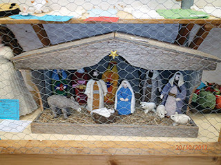 NATIVITY BEHIND CAGED FENCE