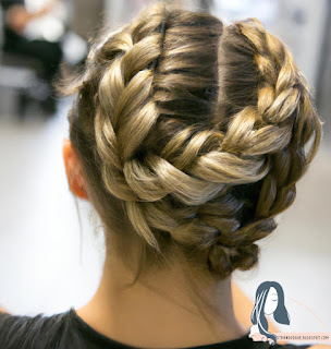 Image of a woman with a fishtail braid in the gym