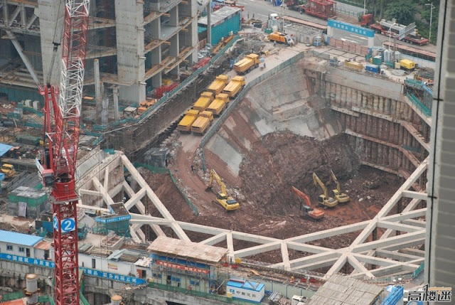 Photo of really deep construction hole right next to The Chow Tai Fook Skyscraper Construction Site, Guangzhou, China