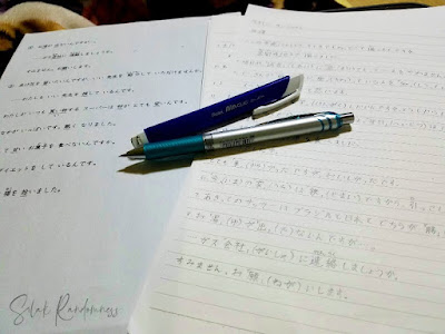 Japanese lessons and notes with a pencil and eraser on top