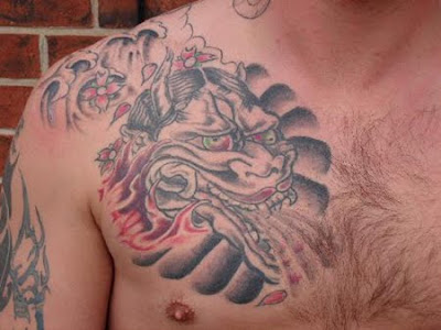 Dragon head chest tattoo