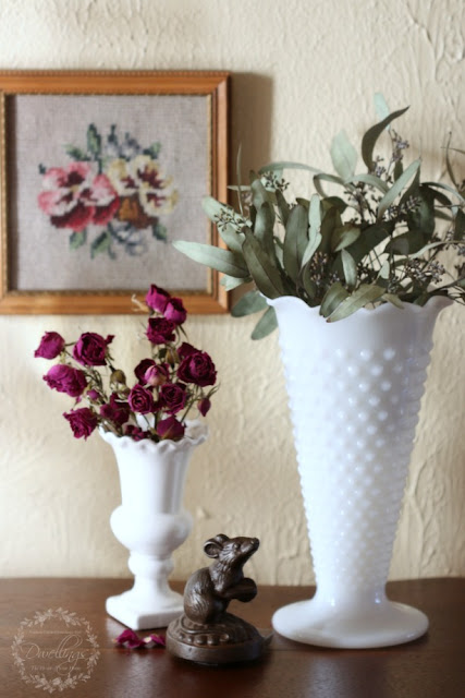 Dried roses and seeded eucalyptus vignette in the hallway.